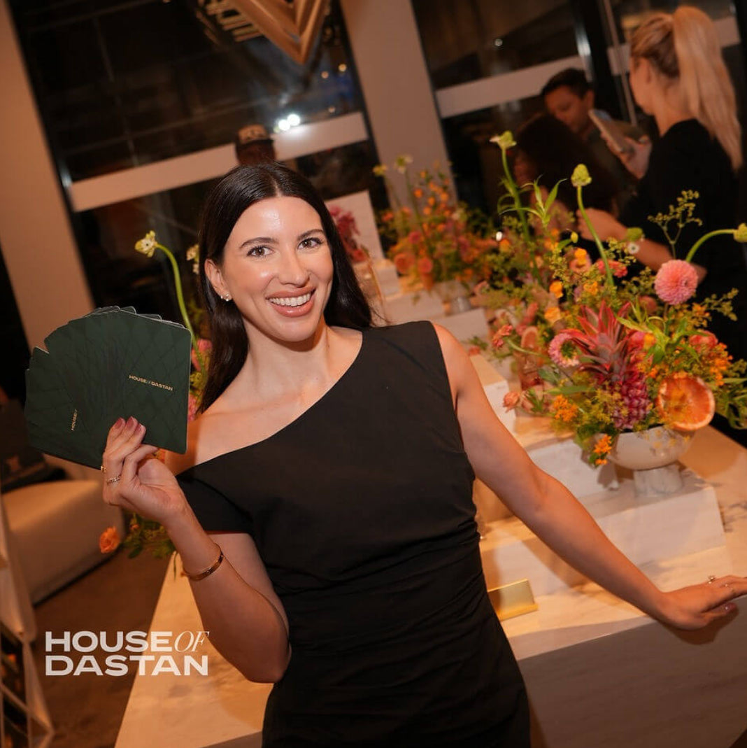 Tarot by Alexis holding House of Dastan cards at their luxury fragrance event in Soho NYC