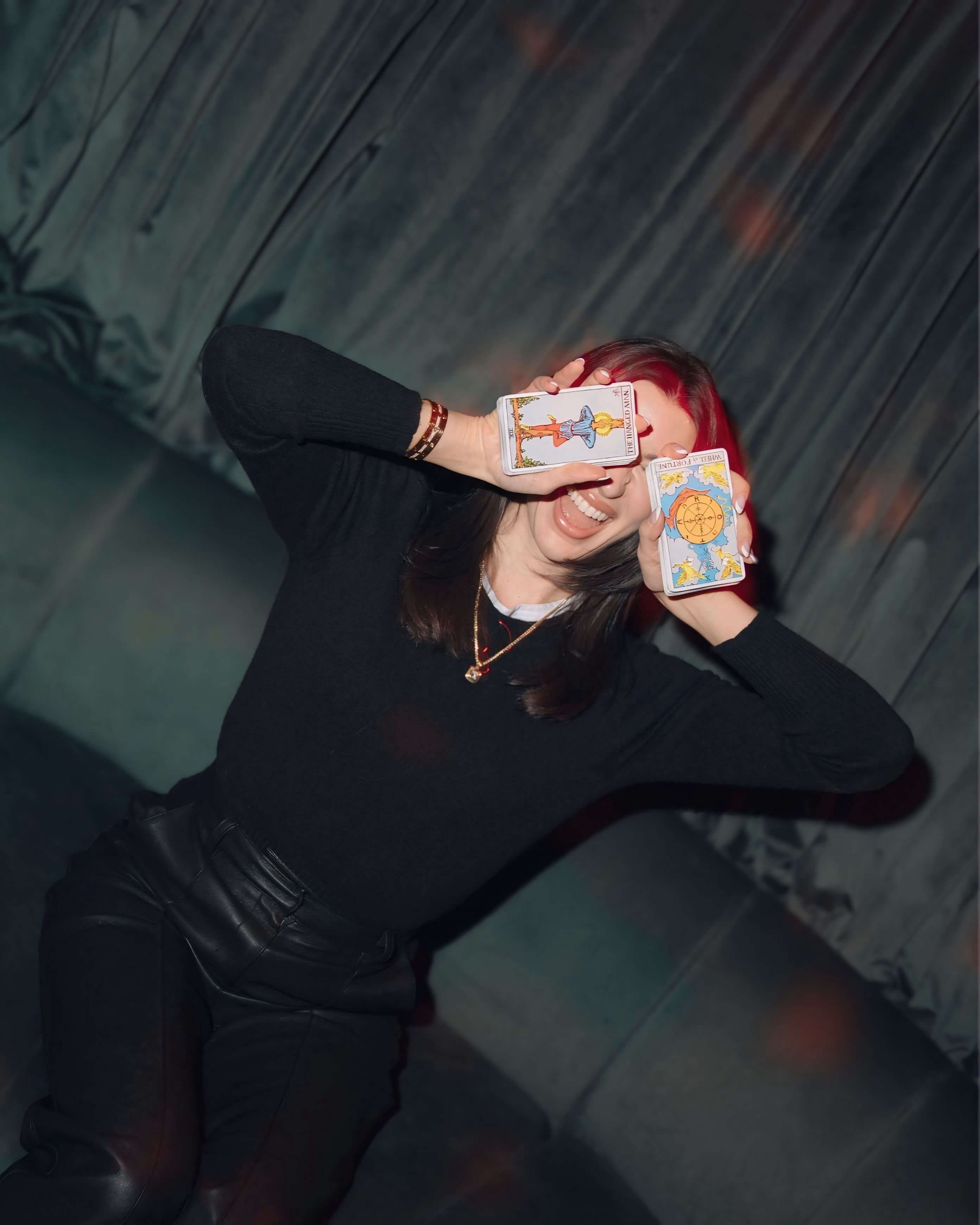 NYC Tarot Reader Alexis posing with tarot cards at Kuona Vision's launch party at The Beekman Hotel in New York City.